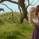 Airk and Dove standing under a tree, k-i-s-s-i-n-g.